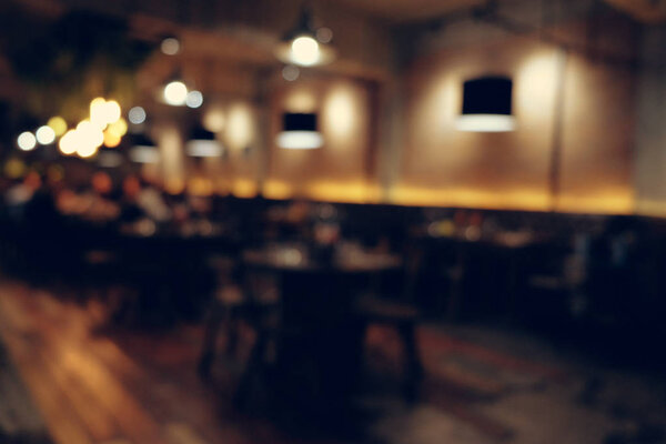 Coffee shop blur background with bokeh light with vintage filter