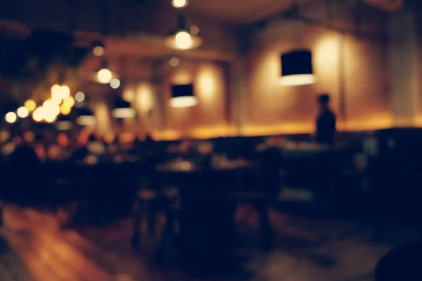 Coffee shop blur background with bokeh light with vintage filter — Stock Photo, Image