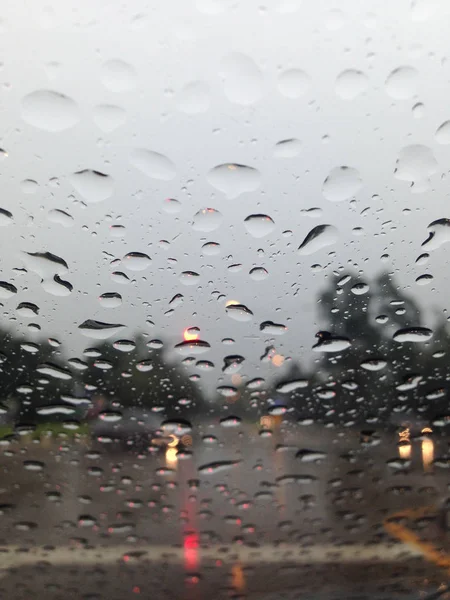 Outside the car in the raining day, View from car seat.