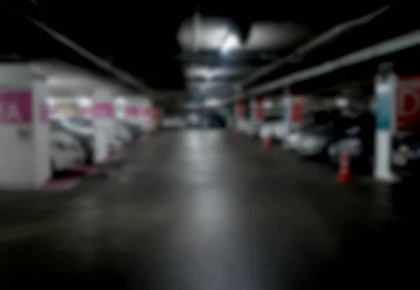 Abstrato carros embaçados estacionamento com luz bokeh Fundo para uso de um — Fotografia de Stock