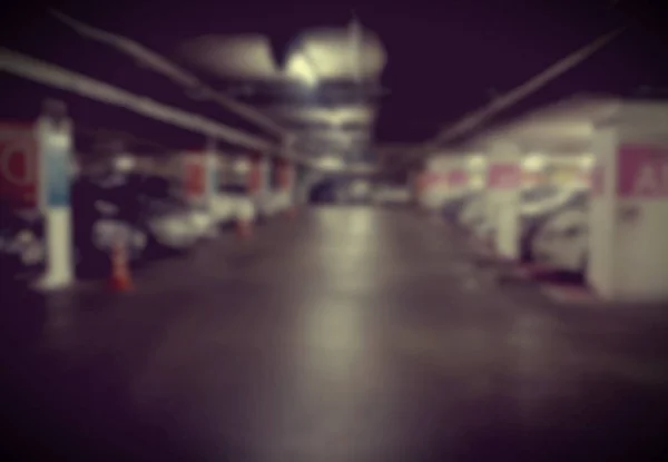 Abstrakt oskärpa bilar parkering med bokeh ljus bakgrund för användning en — Stockfoto