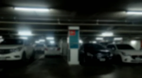 Abstrato carros embaçados estacionamento com luz bokeh Fundo para uso de um — Fotografia de Stock