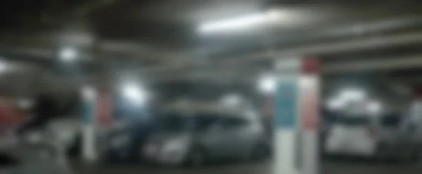 Abstrato carros embaçados estacionamento com luz bokeh Fundo para uso de um — Fotografia de Stock