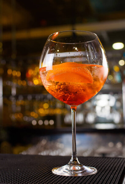 Expert barman is making cocktail at night club, Barman holds a cocktail in his hand. No face. Selective focus