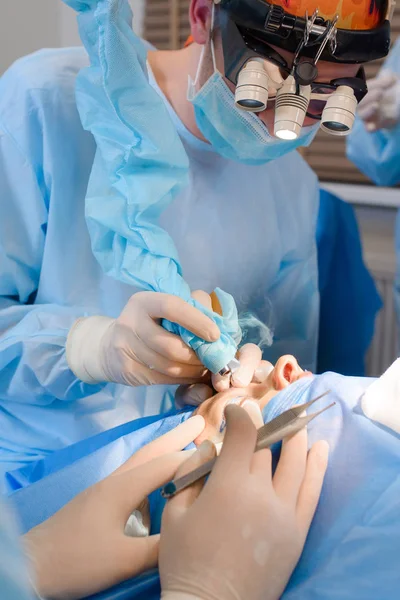 Laser Blepharoplasty, plastic surgery operation for correcting defects, deformities, and disfigurations of the eyelids; and for aesthetically modifying the eye region of the face. in medical clinic — Stock Photo, Image