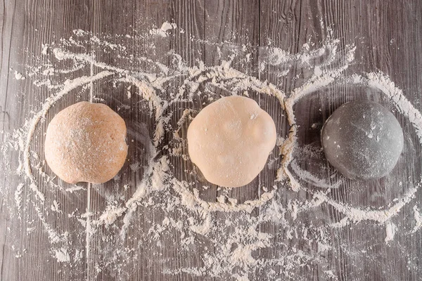 Dough ball with flour. Cooking pizza with italian white dough. Food blanks in restaurant.