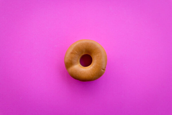 Donuts on pastel pink background