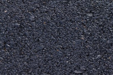 koyu asfalt yol yüzeyinin yakın