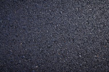 koyu asfalt yol yüzeyinin yakın