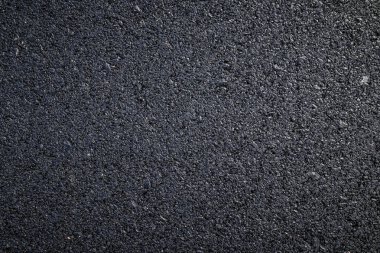 koyu asfalt yol yüzeyinin yakın