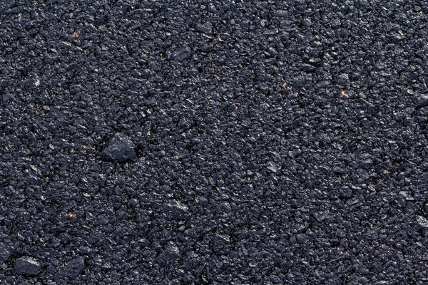 koyu asfalt yol yüzeyinin yakın