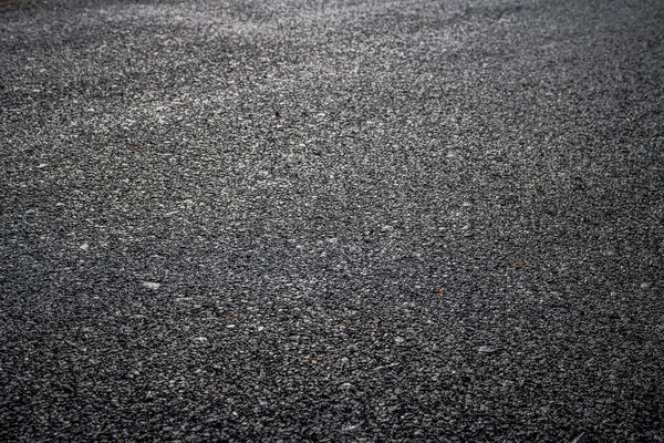 close up of dark asphalt road surface