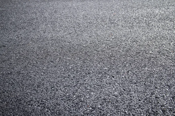 어두운 아스팔트 표면의 — 스톡 사진