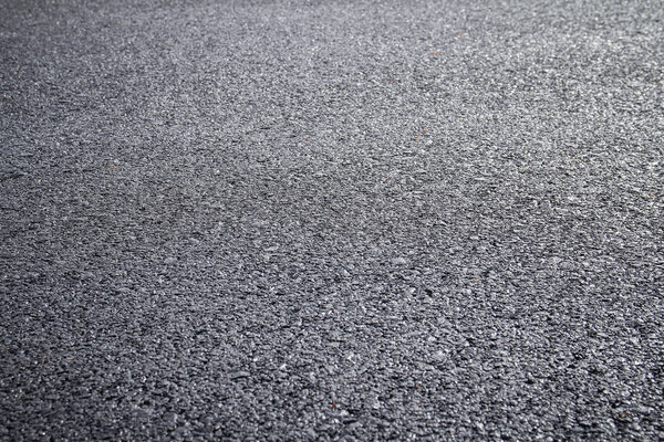 close up of dark asphalt road surface