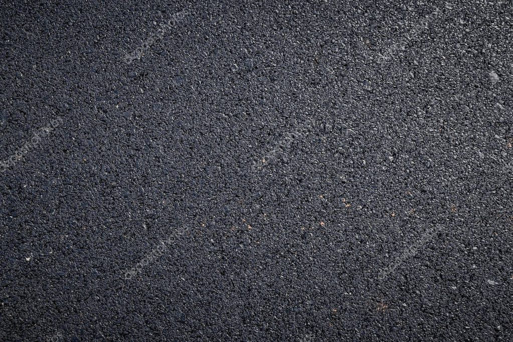 Close up of dark asphalt road surface