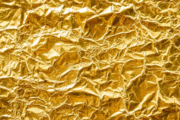 Crumpled gold foil texture background