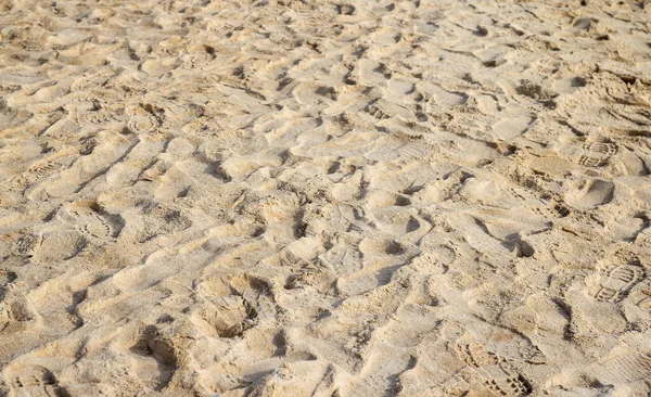 Sea beach sand with many of foot print background