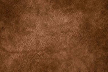 Kalıplı kahverengi deri arkaplan gösteriliyor