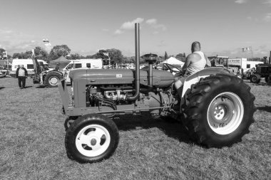 Drayton.Somerset.United kingdom.August 19th 2023.A modified green Fordson Major is on show at a Yesterdays Farming event clipart