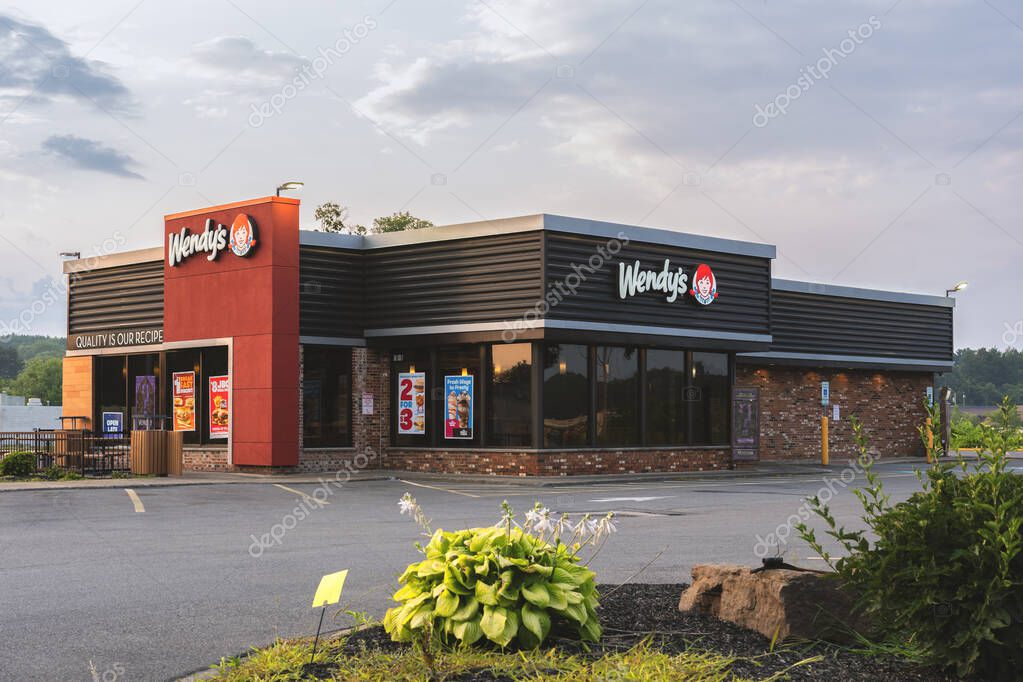 New Hartford, NY - Aug 6, 2025: View of a Wendy's retail location. Wendy's is an international fast food restaurant chain