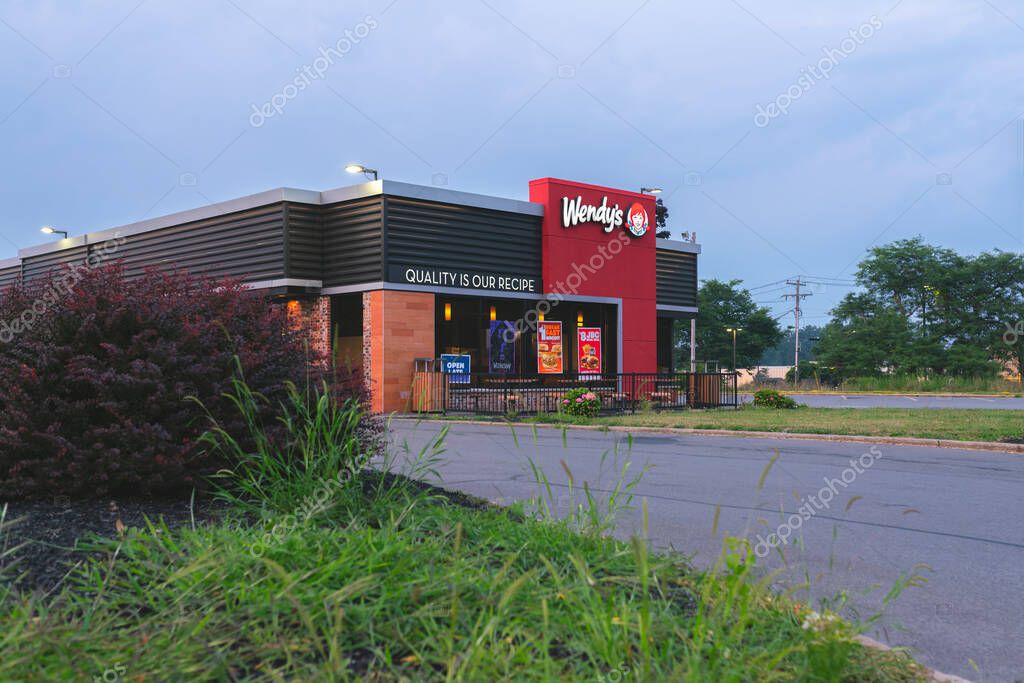 New Hartford, NY - Aug 6, 2025: View of a Wendy's retail location. Wendy's is an international fast food restaurant chain