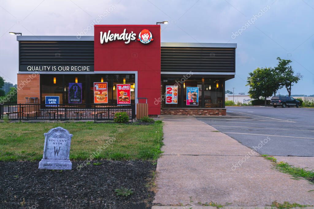 New Hartford, NY - Aug 6, 2025: View of a Wendy's retail location. Wendy's is an international fast food restaurant chain