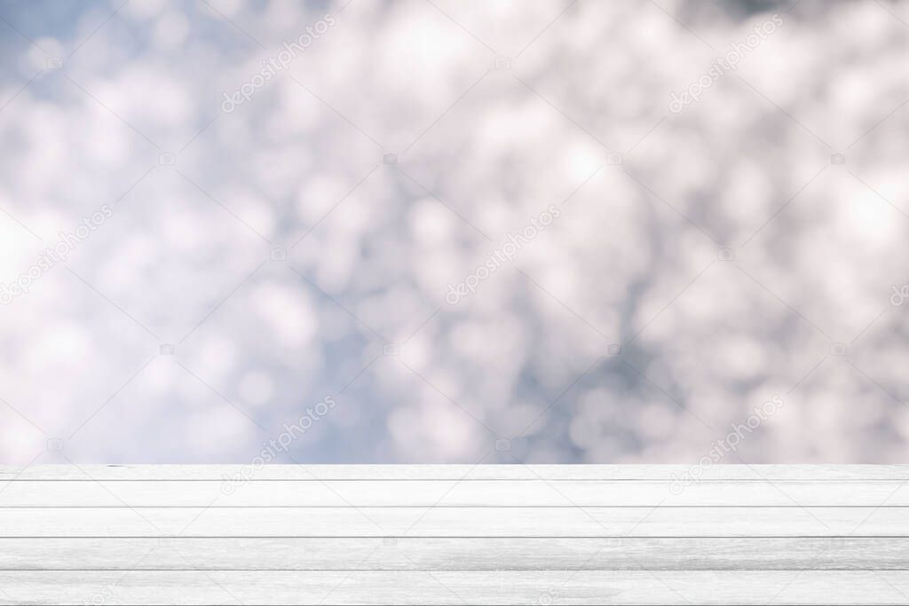 White Wood Table with White Bokeh Background, Suitable for Product Display.