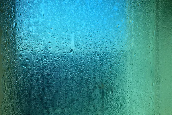 Steam Drops on Glass Window Background.