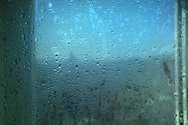 Steam Drops on Glass Window Background.