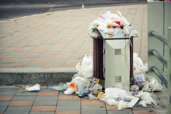 A bin full of garbage / Problem of waste and garbage management concept