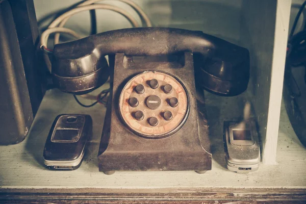 Old telephone in vintage tone