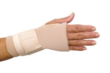 Old female hand wearing hand wrist therapy support glove isolated on white                                  clipart