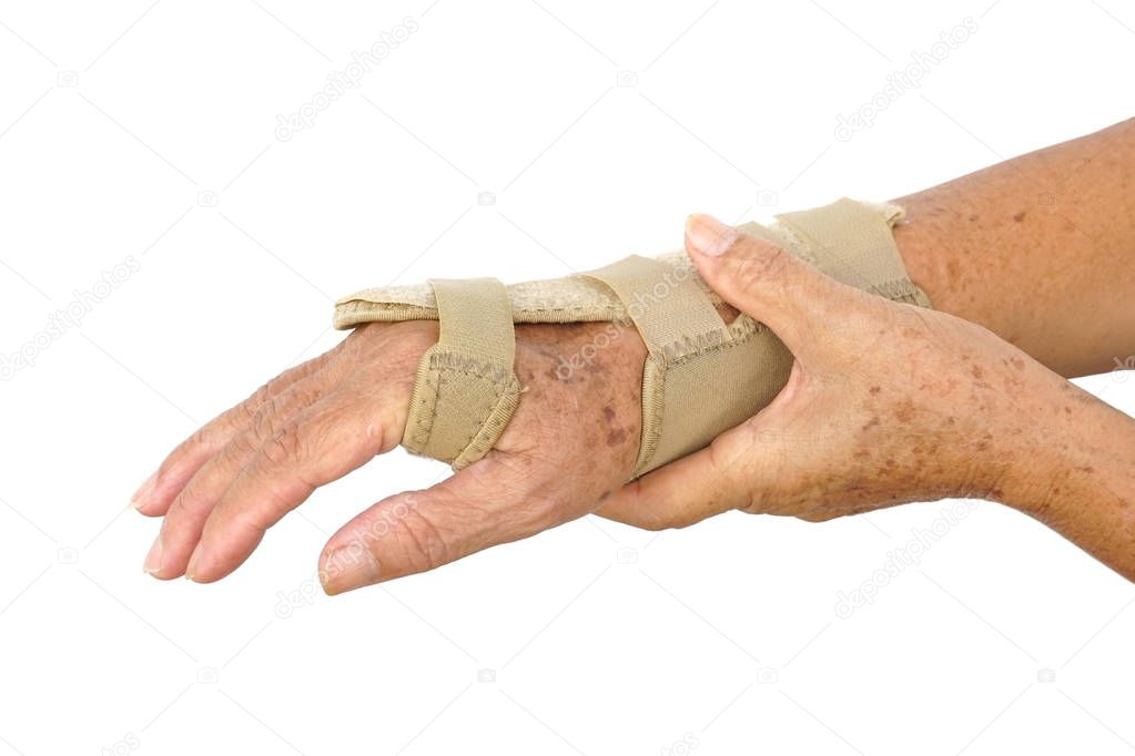 Old female hand wearing hand wrist therapy support glove isolated on white                                  