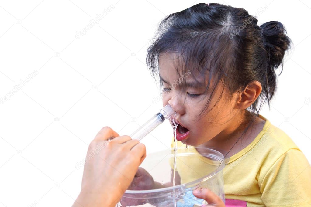 Asian girl using nasal irrigation isolated on white background with copy space to add text