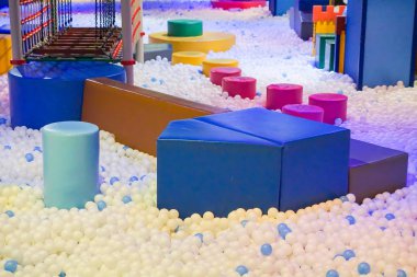 Indoor playground with ball pit and rope bridge clipart