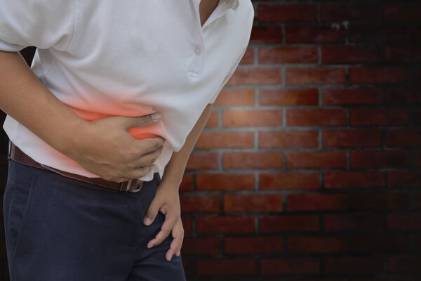 Young man having a stomachache