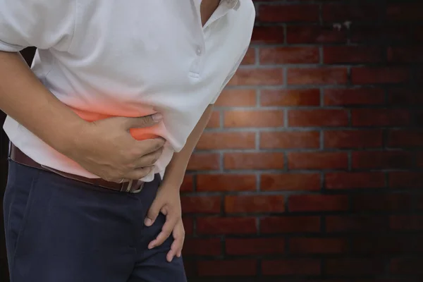 Young man having a stomachache — Stock Photo, Image