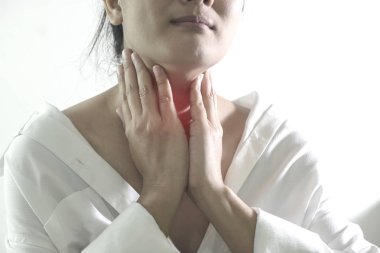 Closeup view of a young woman with Sore throat clipart