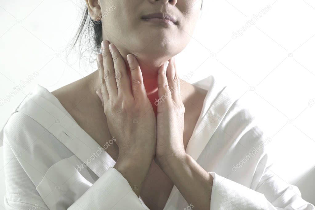 Closeup view of a young woman with Sore throat