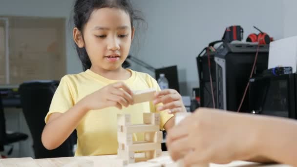 Asian Little Girl Playing Wooden Brick Toy — Stock Video