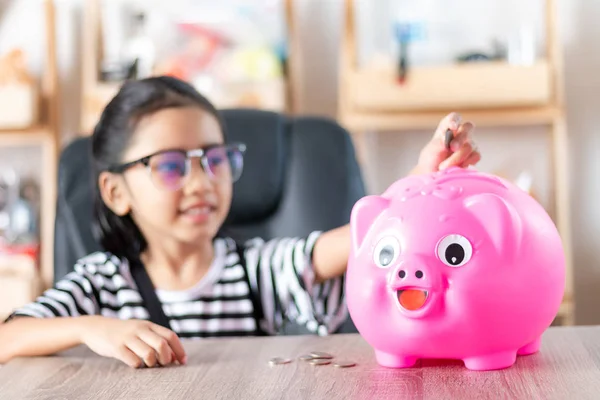 Asian Little Girl Putting Coin Piggy Bank Shallow Depth Field — Stock Photo, Image