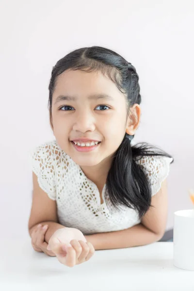 Portrait little Asian girl sitting and smile with happiness sele — Stock Photo, Image