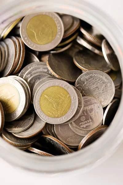 Close up Thai baht coin in the glass jar select focus shallow de — Stock Photo, Image