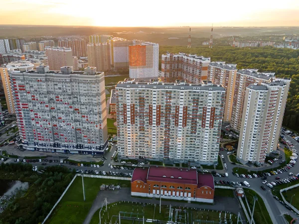 City buildings against the setting sun at sunset