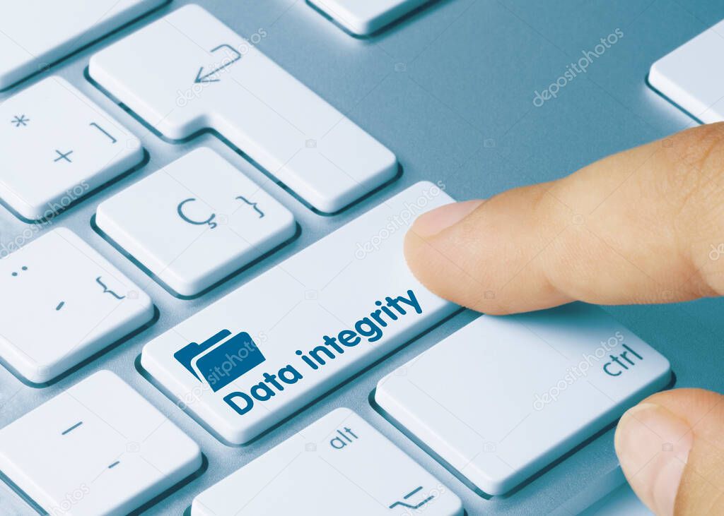 Data integrity Written on Blue Key of Metallic Keyboard. Finger pressing key.