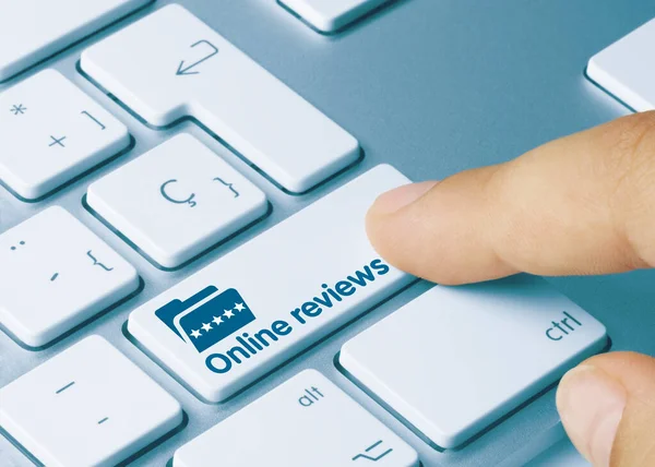 Online Reviews Written Blue Key Metallic Keyboard Finger Pressing Key — Stock Photo, Image