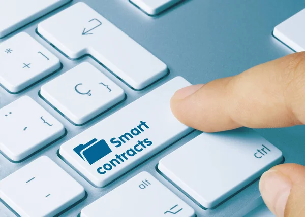 Smart Contracts Written Blue Key Metallic Keyboard Finger Pressing Key — Stock Photo, Image