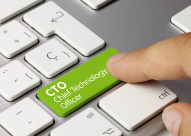 CTO Chief Technology Officer Written on Green Key of Metallic Keyboard. Finger pressing key. clipart