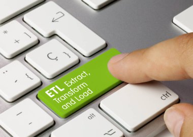ETL Extract, Transform and Load Written on Green Key of Metallic Keyboard. Finger pressing key. clipart