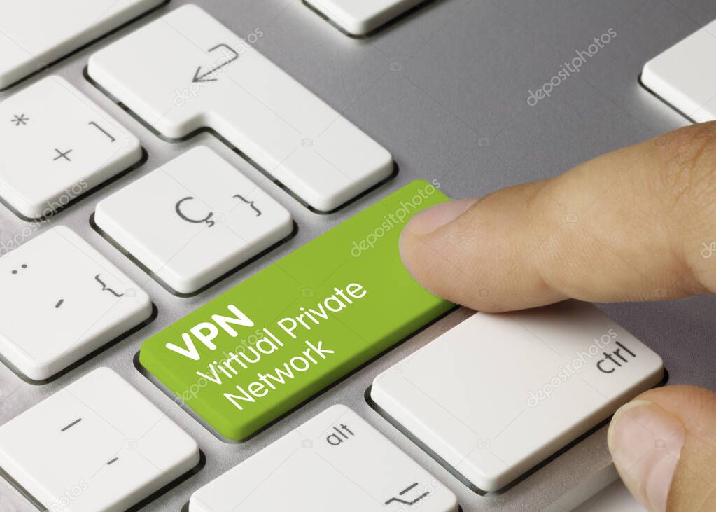 VPN virtual private network Written on Green Key of Metallic Keyboard. Finger pressing key.